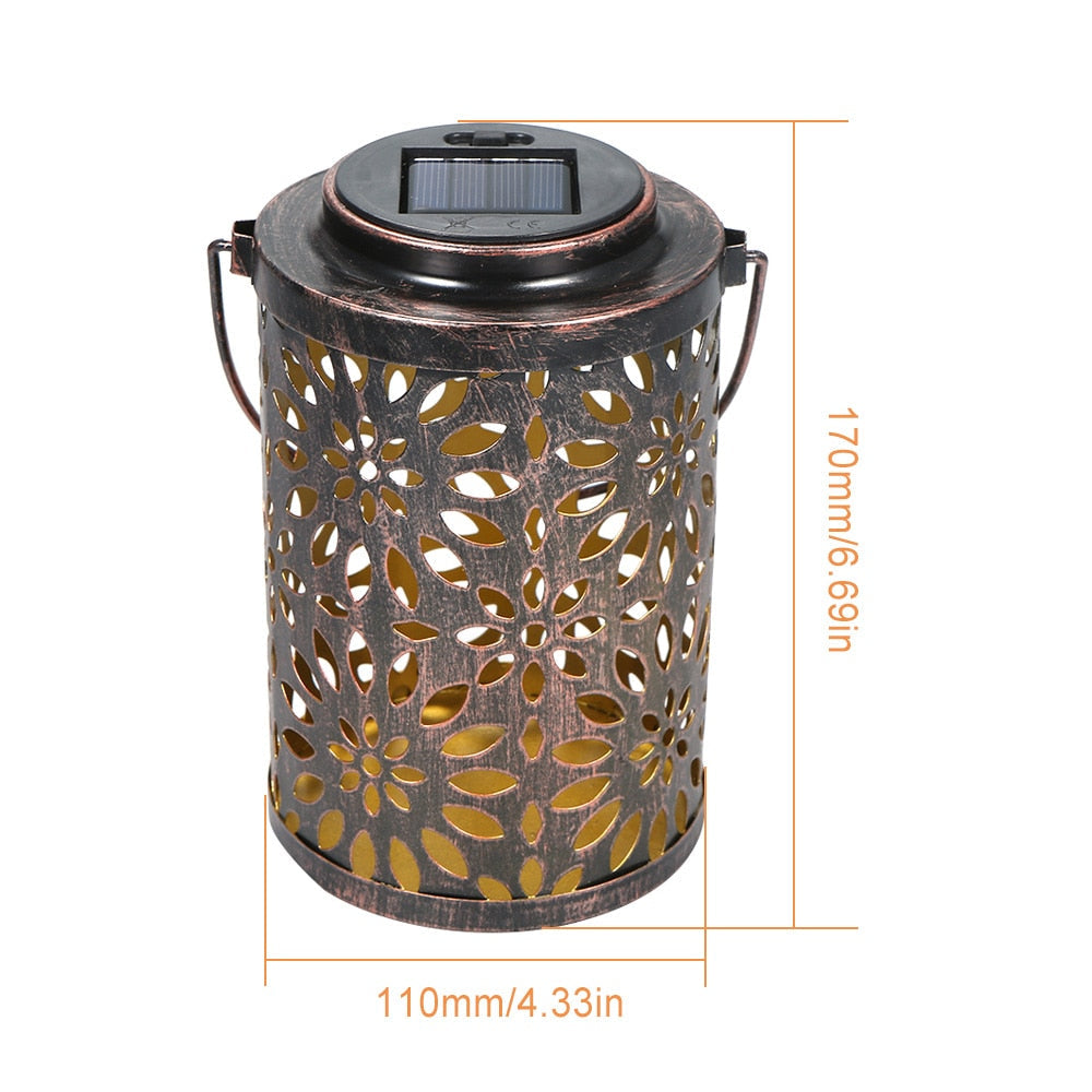 https://cdn.shopify.com/s/files/1/0271/8731/4772/products/Lanterne-solaire-fer-fleurs-0.jpg?v=1614782470