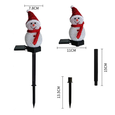Piquet solaire bonhomme de neige éclairant un jardin