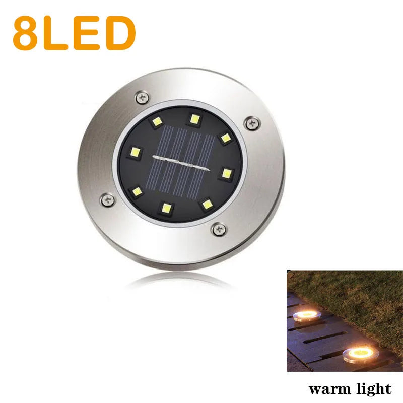 Lampe solaire encastrée éclairant un paysage de jardin la nuit
