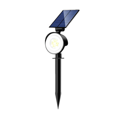 Projecteur solaire paysager éclairant un massif