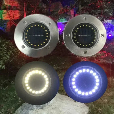 Lampe solaire disque étanche éclairant un jardin
