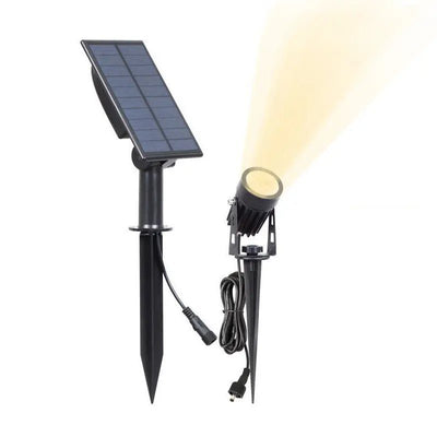 Spot solaire LED à planter pour éclairer un arbre