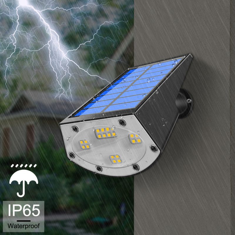 Lampe solaire jardin à piquer LED RGB 20W plantée dans un massif