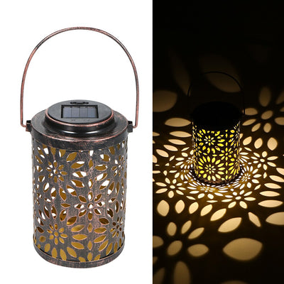 https://cdn.shopify.com/s/files/1/0271/8731/4772/products/Lanterne-solaire-fer-fleurs-5.jpg?v=1615819492