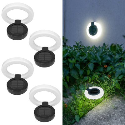 Spot solaire encastrable éclairant un jardin la nuit