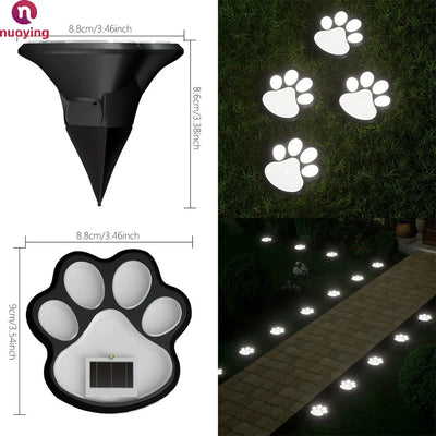 Lampe solaire patte de chat posée dans un massif