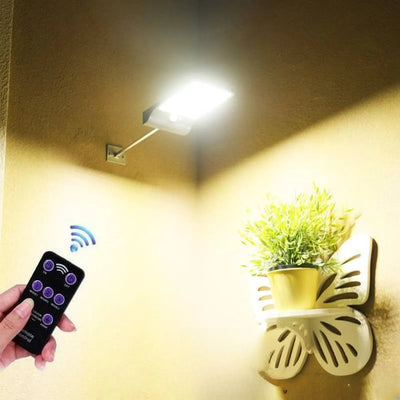Applique solaire murale avec mât éclairant une façade