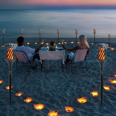 Flambeau solaire effet flamme ambiance plage soirée