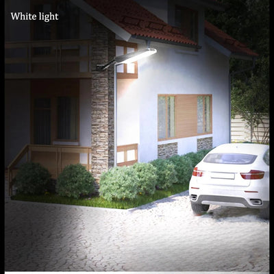 Lampadaire solaire 1000lm éclairage blanc devant une maison