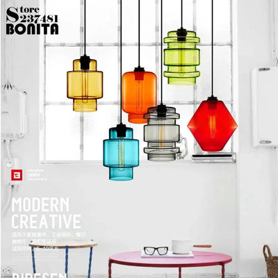 https://cdn.shopify.com/s/files/1/2499/8120/files/lustre-suspendu-moderne-en-verre-transparent-design-l-gant-2.jpg?v=1728060756