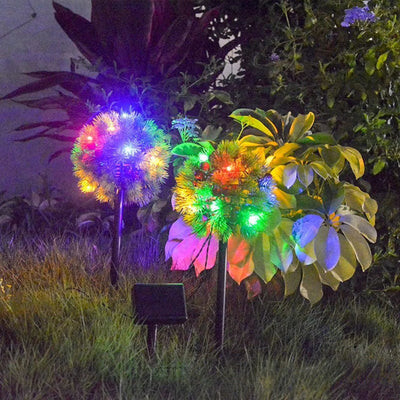 Lampe solaire pomme de pin allumée multicolore la nuit