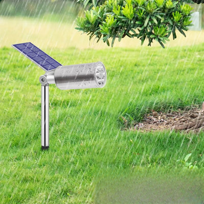 Spot solaire orientable en inox planté dans le jardin
